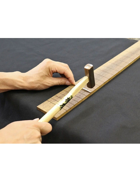 fretting a guitar